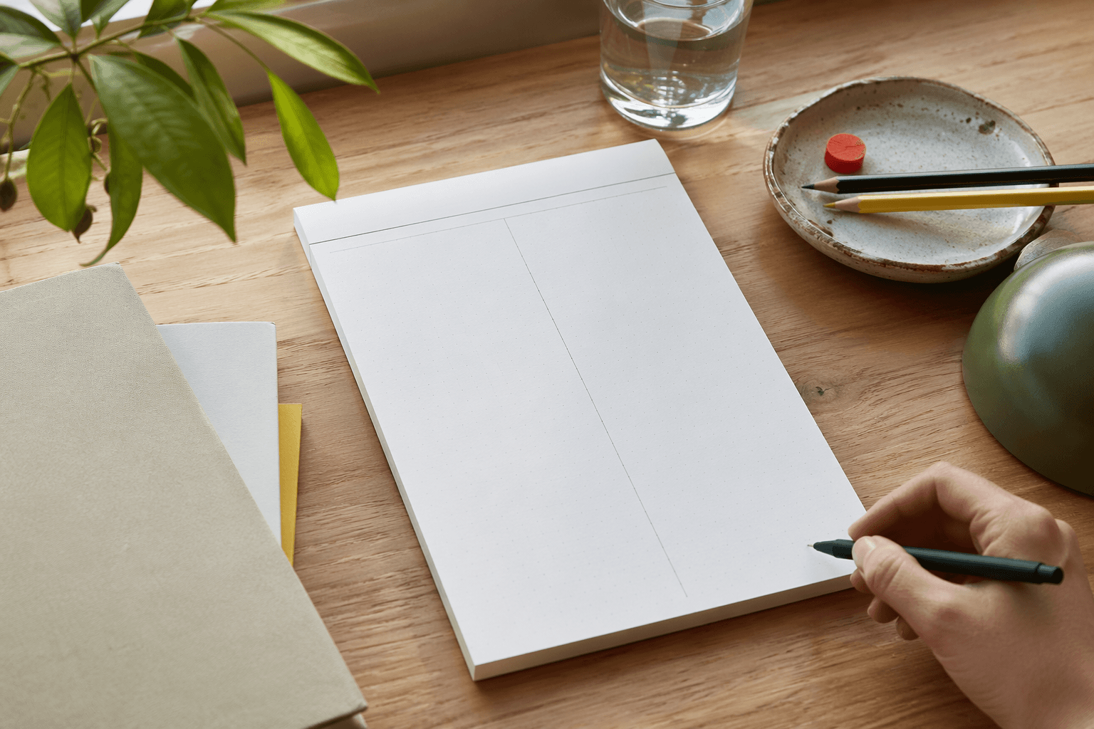 Meeting Notes Pad in use on a desk